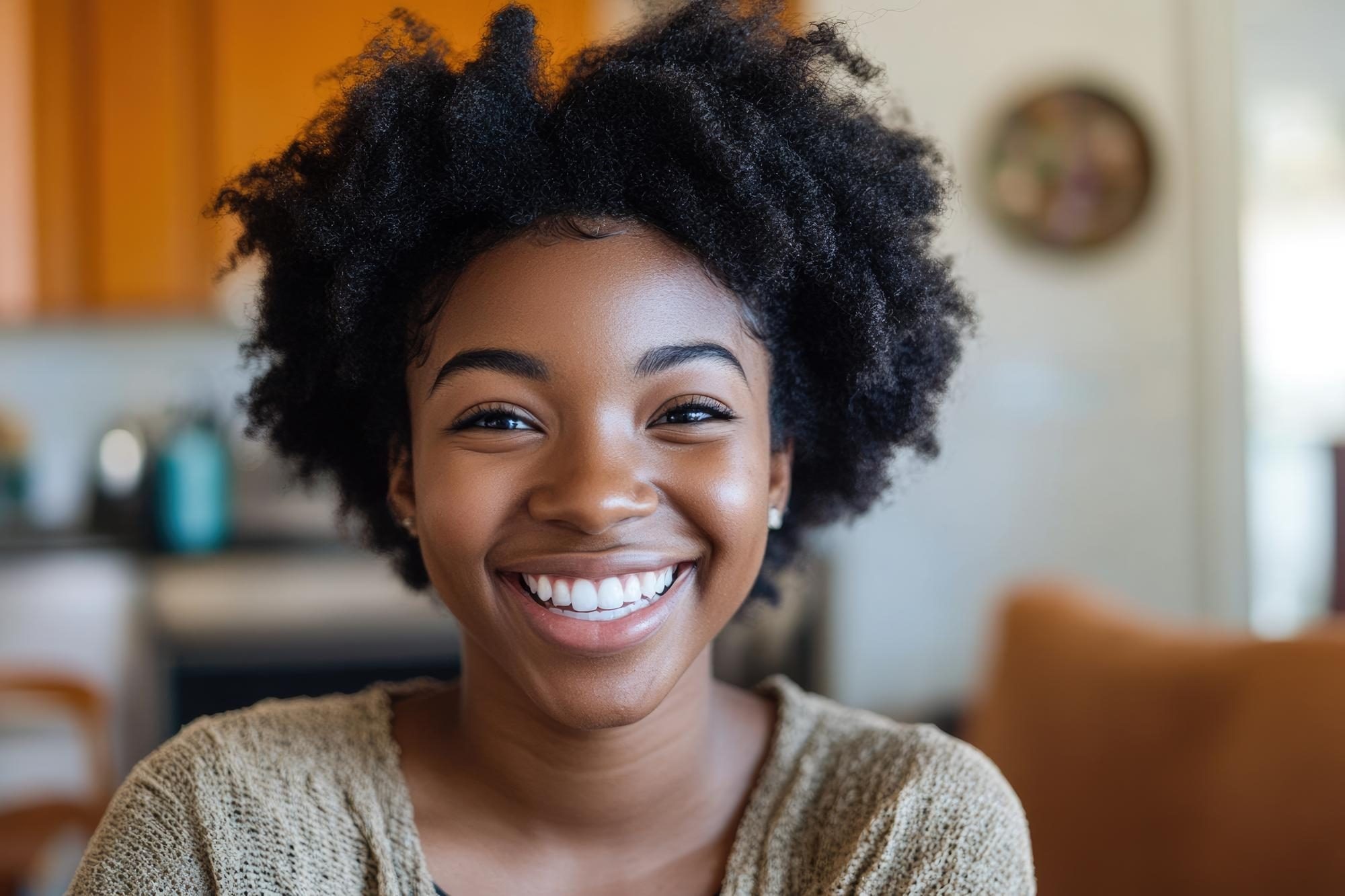 A patient smiling warmly at home